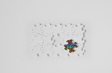Business concept,top view of jigsaw puzzle with one piece with caption idea fits in, completing a...