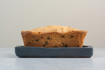 Delicious hot fresh cake on dark board