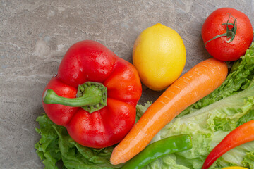 A lot of fresh vegetables on marble background