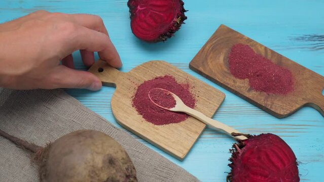 Heap of dried beet root powder, selective focus, gluten-free beetroot flour. Selective focus