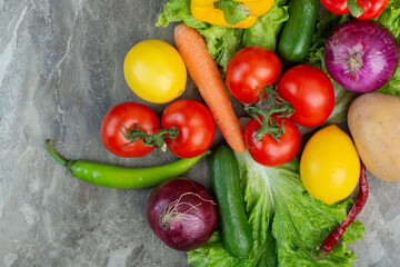A lot of fresh vegetables on marble background
