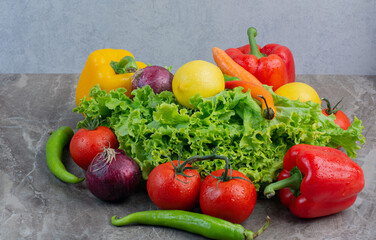 A lot of fresh vegetables on marble background