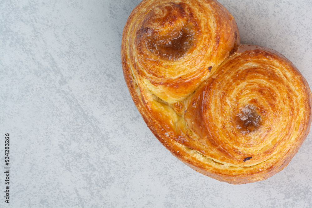 Wall mural Sweet delicious pastries on dark board