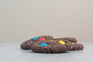 Round sweet chocolate cookies on white background