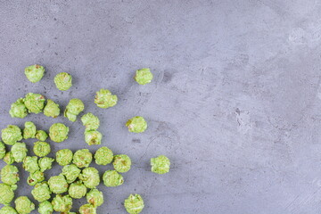 A pile of popcorn candy spilled over on marble background