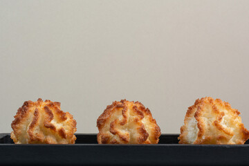 Three round fresh delicious cookies on dark plate