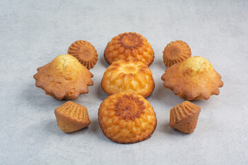Sweet delicious cupcakes on white background