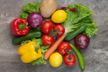 A lot of fresh vegetables on marble background