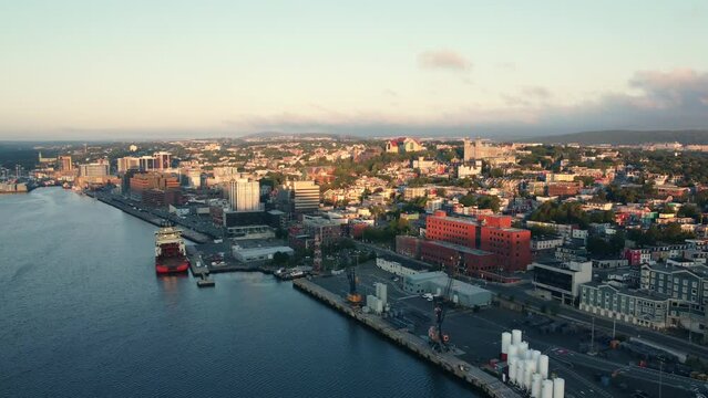 An overview of St. John's city centre bathed in warm light