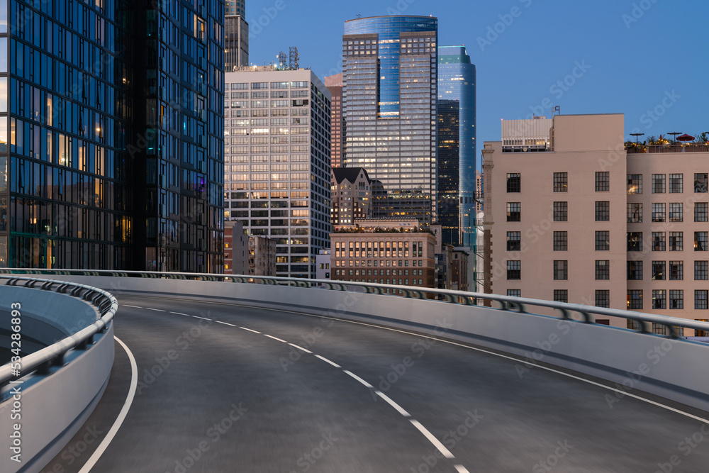 Wall mural Empty urban asphalt road exterior with city buildings background. New modern highway concrete construction. Concept of way to success. Transportation logistic industry fast delivery. Los Angeles. USA.