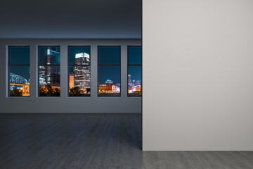 Fototapeta premium Downtown Nashville City Skyline Buildings from High Rise Window. Beautiful Expensive Real Estate overlooking. Empty room Interior. Mockup wall. Skyscrapers Cityscape. Night. Tennessee. 3d rendering.