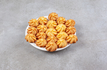 Homemade cookies on a plate on marble background