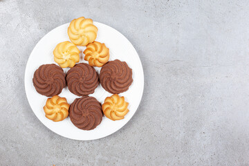 A plate full of homemade cookies on marble background