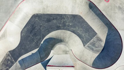 Aerial drone Skate Park concrete bowl shot, large skatepark zone, kick scooter skateboard riders training, skateboarding playground. - Powered by Adobe