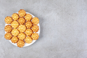 Homemade cookies on a plate on marble background