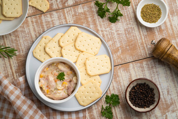 Tuna salad with butter cracker on a plate,snack food.Top view