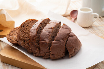 Chocolate chip flavored bread ,Sliced brown bread on wooden board