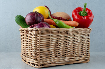 Bunch of various vegetables in wooden basket