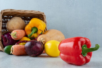 Bunch of various vegetables out of wooden basket