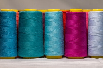 Spools of thread for a sewing machine