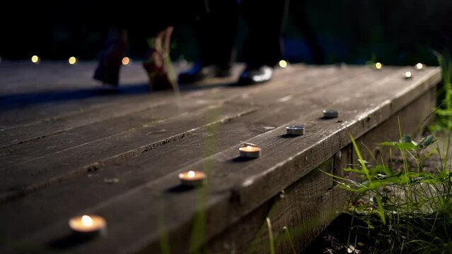 Closeup dancers legs, the dancers enter the wooden stage.
