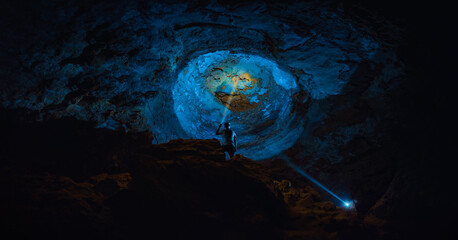 Interior of a large room inside a cave.