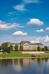 reflection of an old building in dresden on elbe river