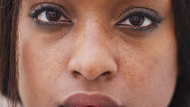 Face, beauty and empowerment with the eyes of a woman closeup and confident taking a stand against gender based violence. Zoom, strong and equality with a portrait of a female human rights activist
