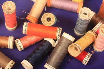 sewing threads on blue background