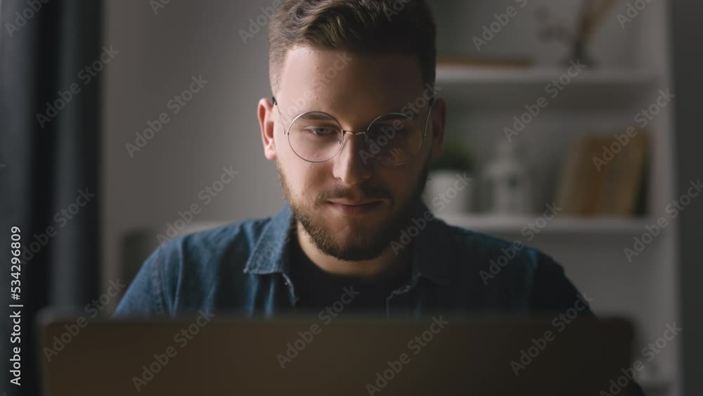 Aufkleber close up view of handsome bearded man typing on laptop, young coder writing code, home office with l