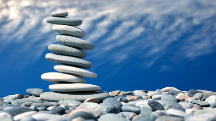 balance of stones on the background of nature. pyramid of smooth stones against a colored sky. natural balance of life.
