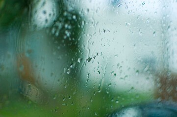 Close up of a glass surface covered in waterdrops.