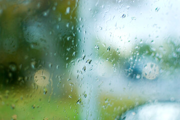 Close up of a glass surface covered in waterdrops.