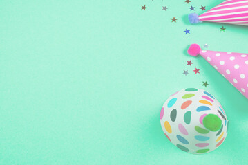 Colorful birthday caps on a blue background. Top view.