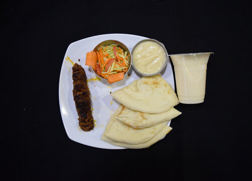 Beef Kebab or kabab with Naan Ruti. Beef shik kabab or tikka. Indian Beef shekh kebab with salad. Turkish Kebab.