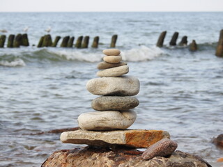 pyramid of zen stones on the beach