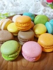 colorful macaroons on a wooden table