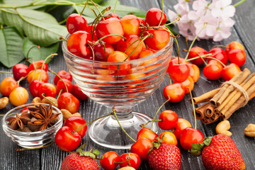 red yellow cherries on wood background
