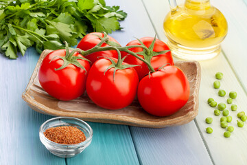tomato branch on wood background