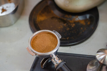 Barista making a cup of coffee soft focus image 