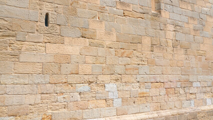 Pared de sillares de piedra en fachada monumental