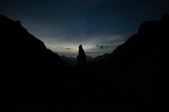 Silhouettes Of Rock Formations On Campanile Di Val Montanaia Mountain Peak In Italy At Night