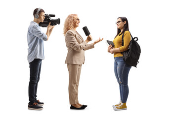 Female reporter interviewing a student and camera man recoridng