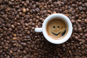 Cup of coffee on coffee beans background