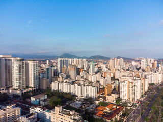 Fototapeta premium Aerial view of the waterfront to the ocean with its high buildings in the city of Santos in Brazil