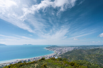 Attractive spring cityscape of Vlore city from Kanines fortress. Captivating morning sescape of Adriatic sea. Spectacular outdoor scene of Albania, Europe. Traveling concept background.