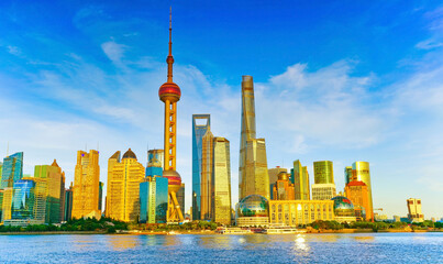 View of the skyline along the riverside on a sunny day in Shanghai, China.