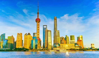 Fotobehang View of the skyline along the riverside on a sunny day in Shanghai, China. © Javen