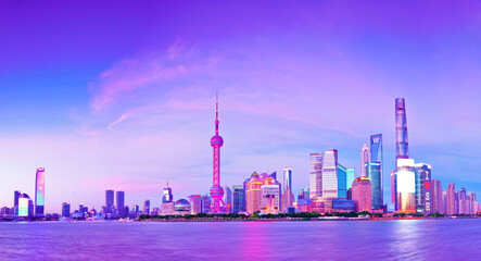 Fototapeta na wymiar View of the skyline along the riverside at dusk in Shanghai, China.