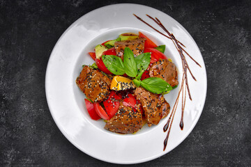 Thai salad on a white plate close-up